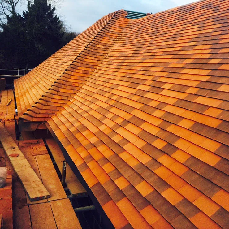 Close-up of a new hand-laid clay tiled roof by C.A. Bond & Sons