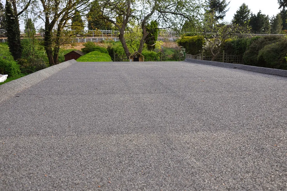 New mineral felt flat roof on a rear extension overlooking a garden