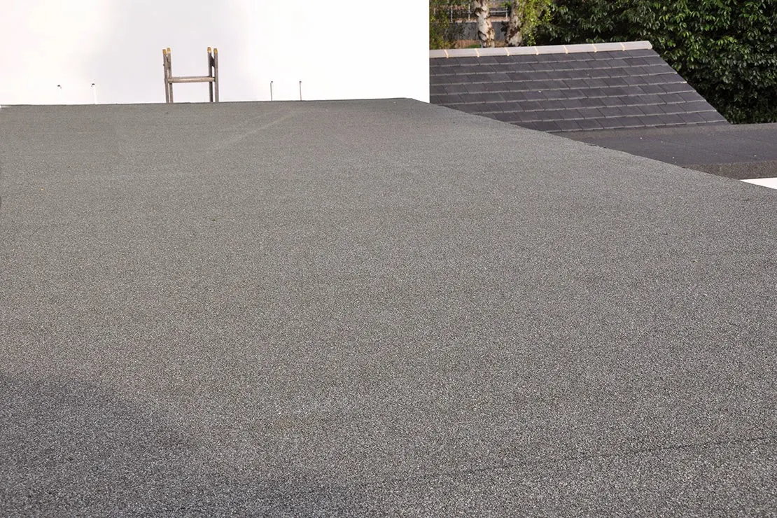 New flat roof on a side lean-to beside a pitched slate roof