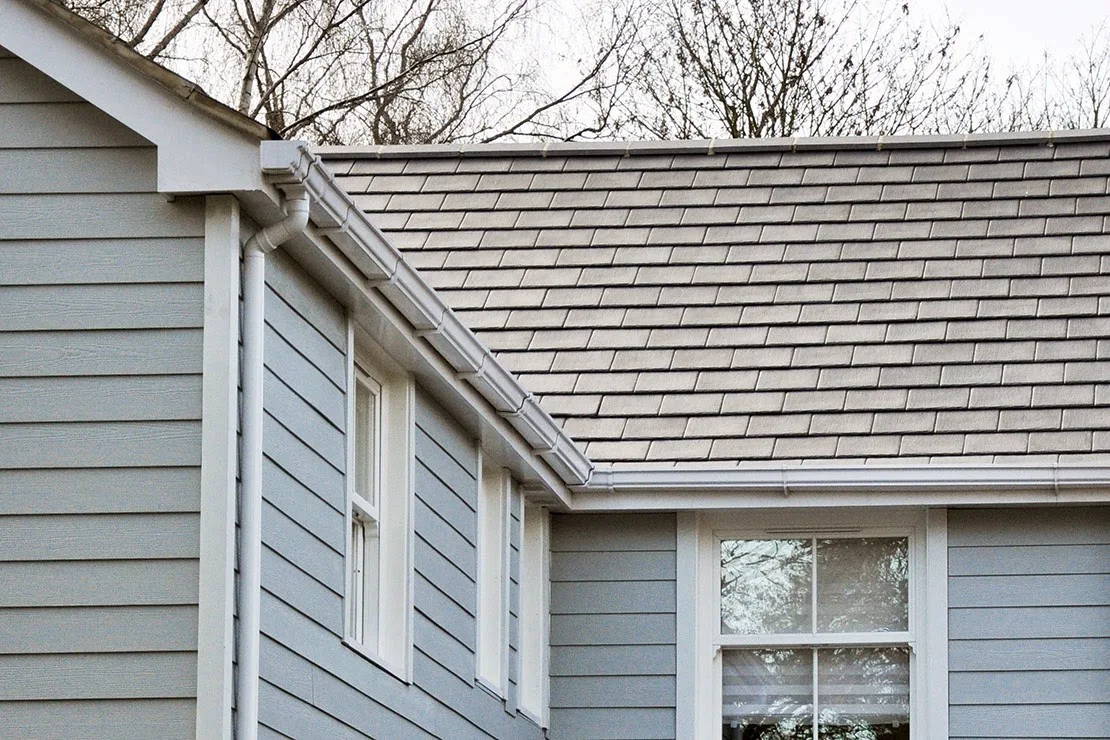 Slate-effect roof with new white fascias, soffits and guttering